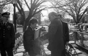 Archives employee Bruce Haase hands the Official State Bible over for the Inauguration 1989