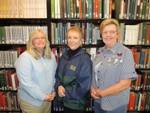 (Left to right) Research Room Supervisor Dawn Mitchell stands with Genealogy Research Volunteers Nancy Lyons and Sally Williams.