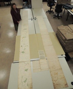 Archivist Margaret Dunham with a very long Orphans Court document. 