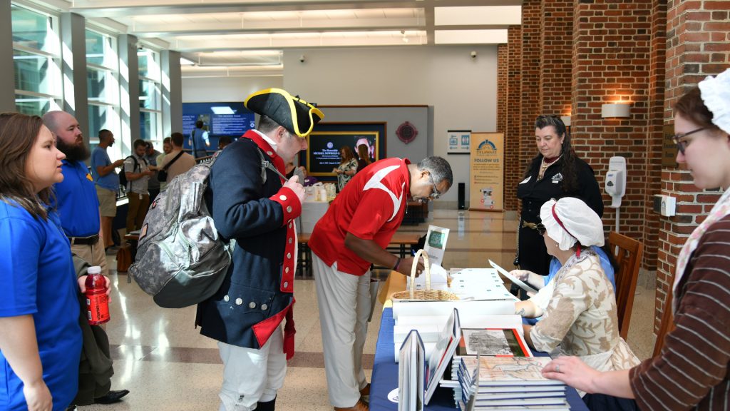Educators and historic site partners check in at the event registration table.