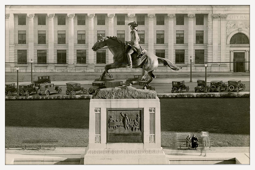 A monochrome photograph showing the Equestrian Statue of Caesar Rodney in front of Wilmington's City Hall.
