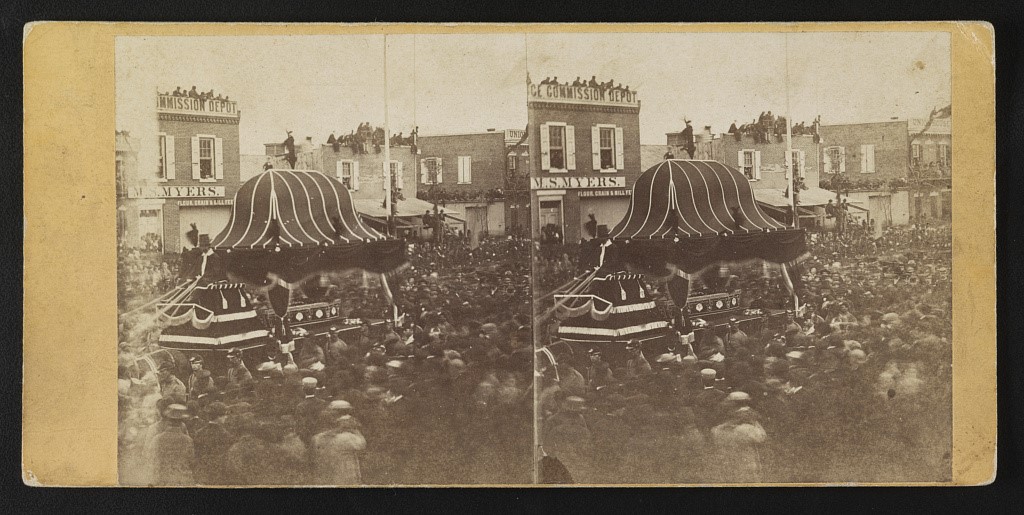 “Lincoln’s Funeral,” Philadelphia. Photo has casket parade around lots of people.