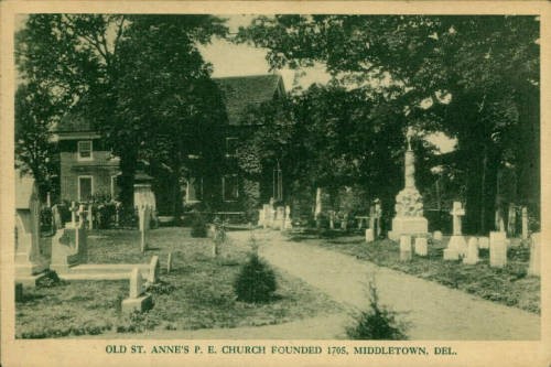 Old St. Anne's P. E. Church postcard with headstones and church in background.